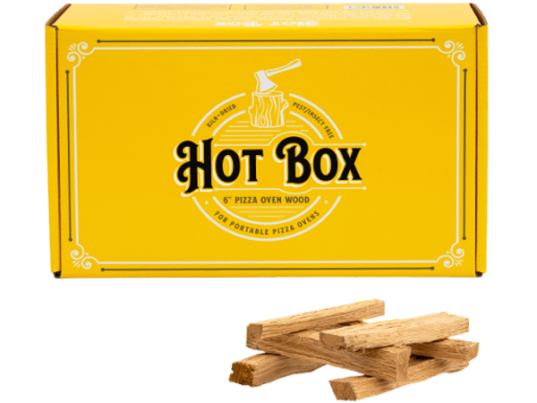 An open box of 6" pizza oven wood from Hot Box Cooking Wood