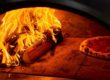 Kiln-dried wood heating a pizza oven